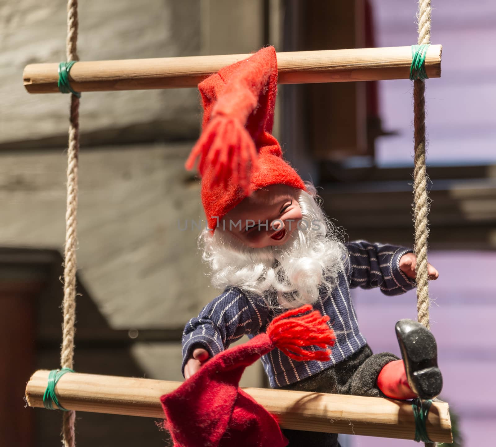 santa claus puppet with big smile on rope ladder