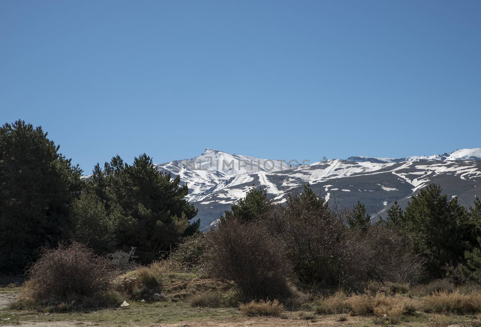 snow on the mountain tops of the sierra nevada in andalusia spain