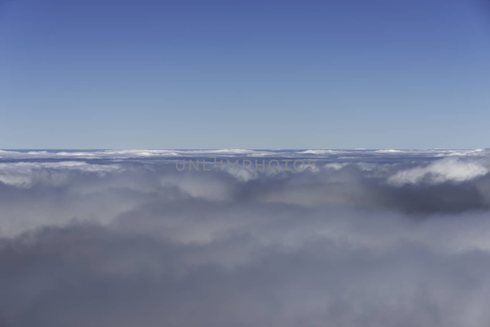 blue sky and clouds on the horizon from airplane view