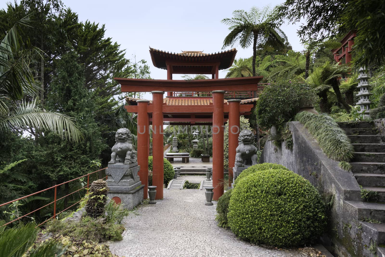 entrance of the japanese garden with red pagoda of the botanical garden madeira