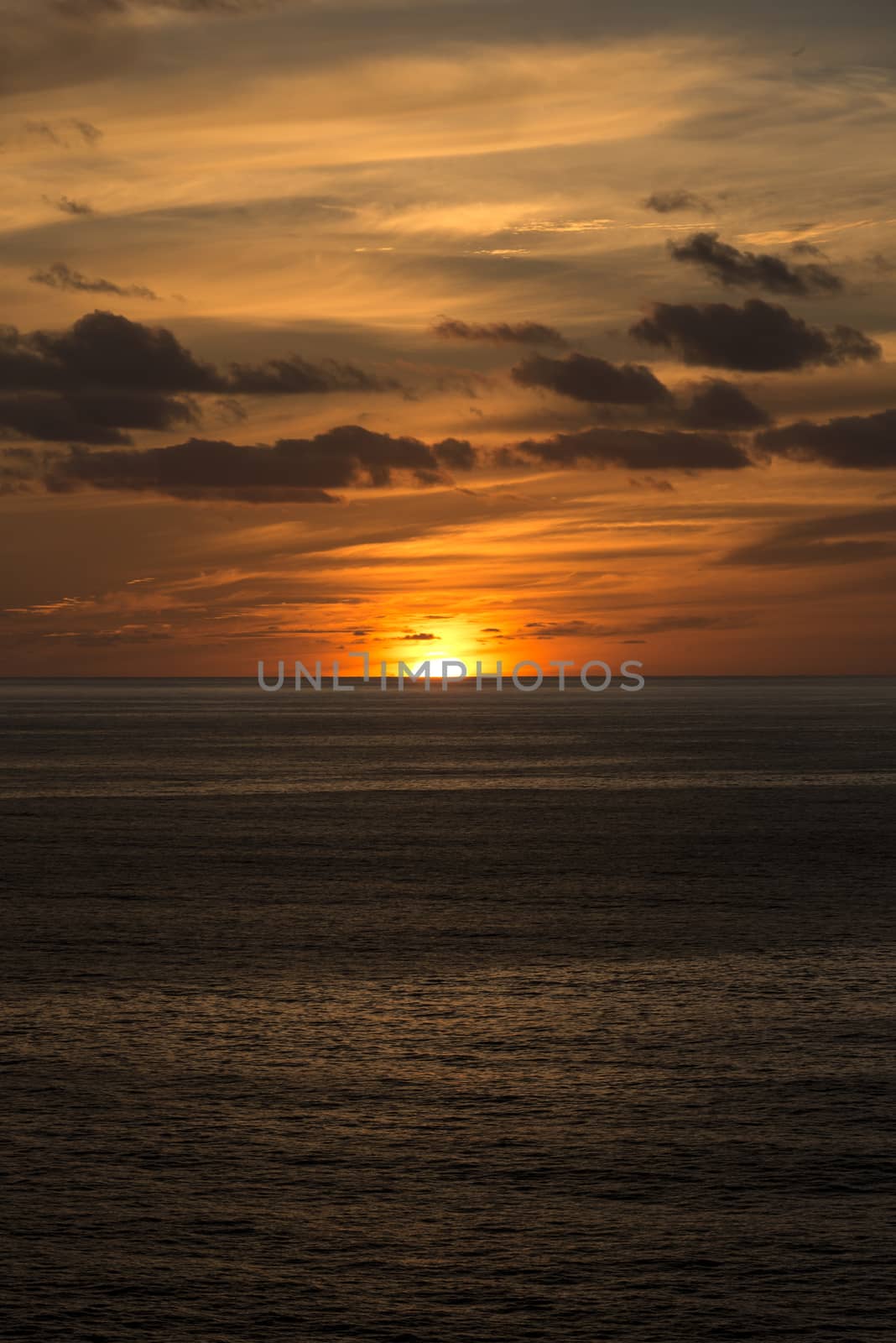 orange red sunset in portugal in atlantic ocean