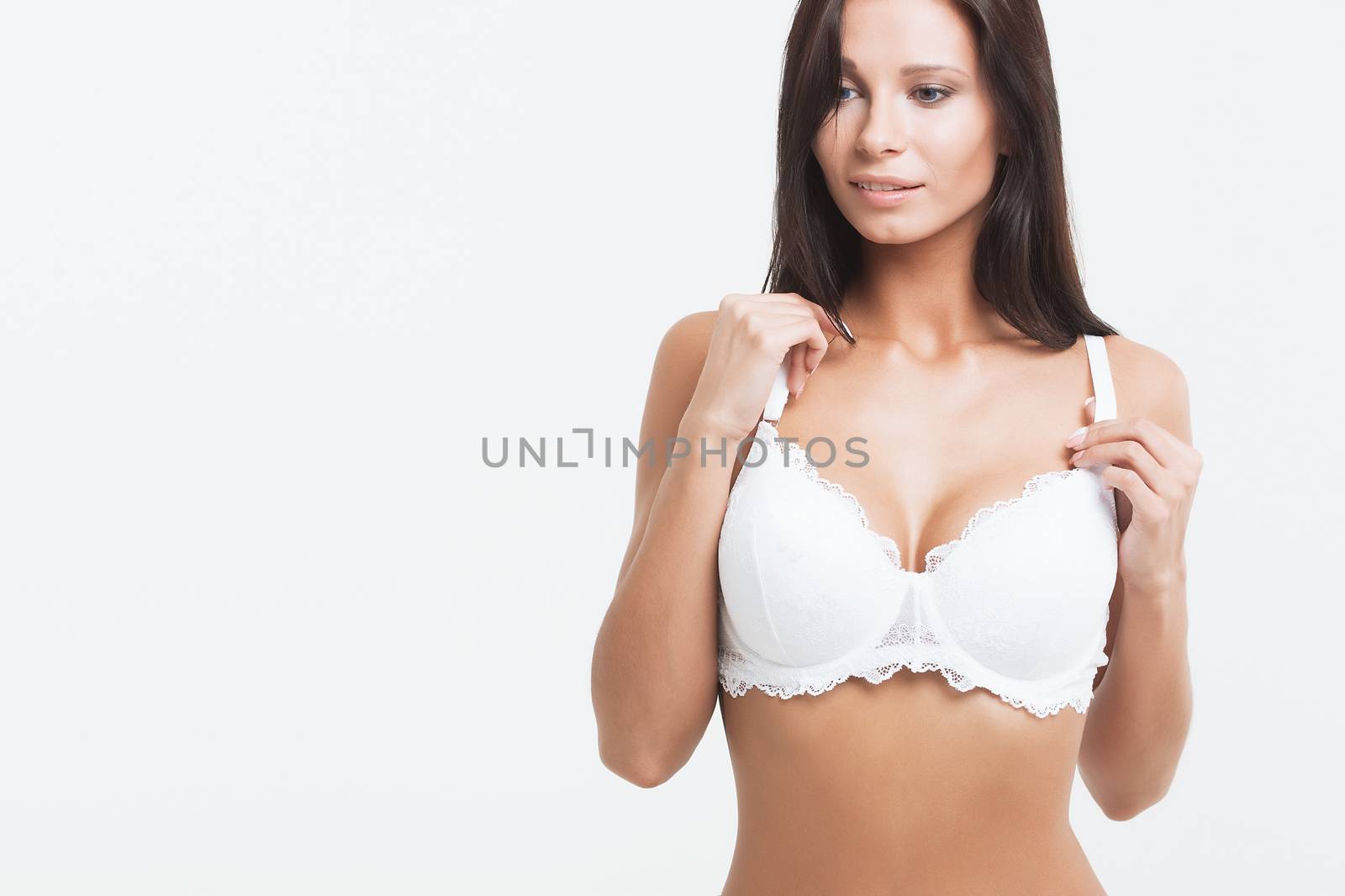 Woman breast in uplift on a white background