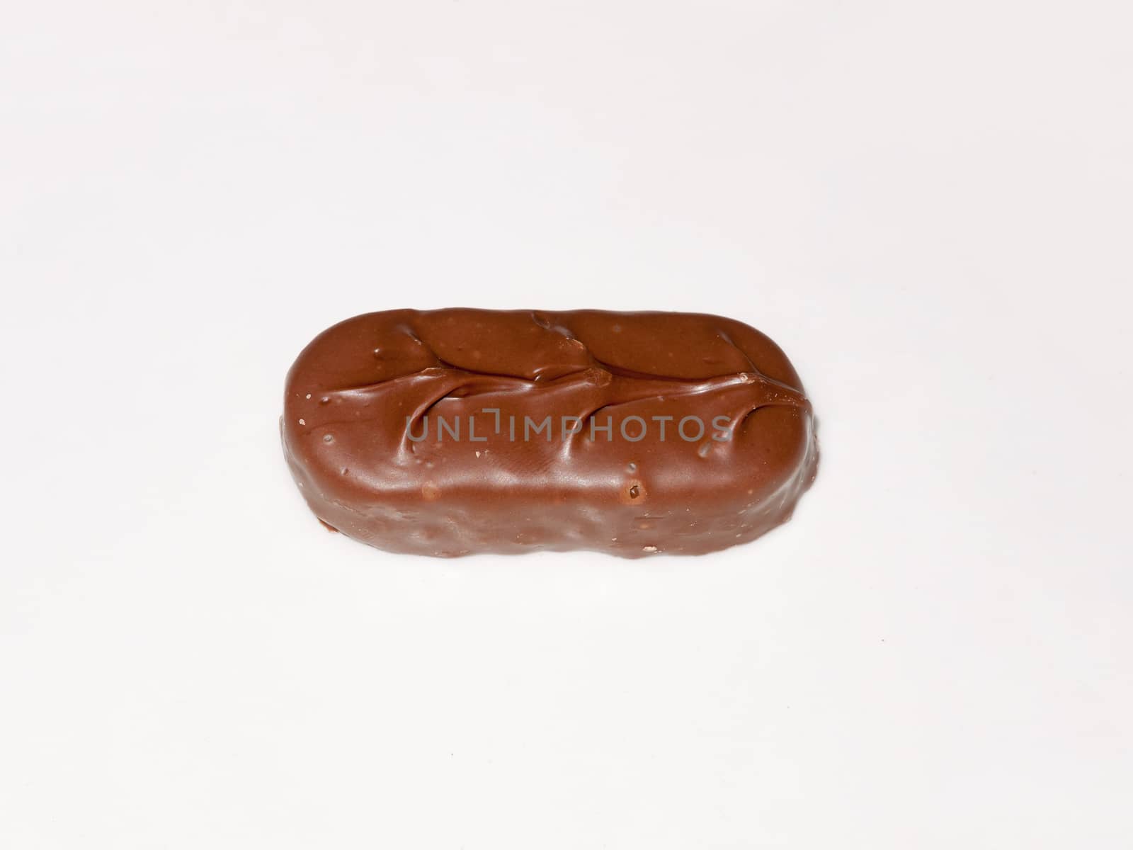 brown chocolate bounty bar on white surface sweets food; essex; england; uk