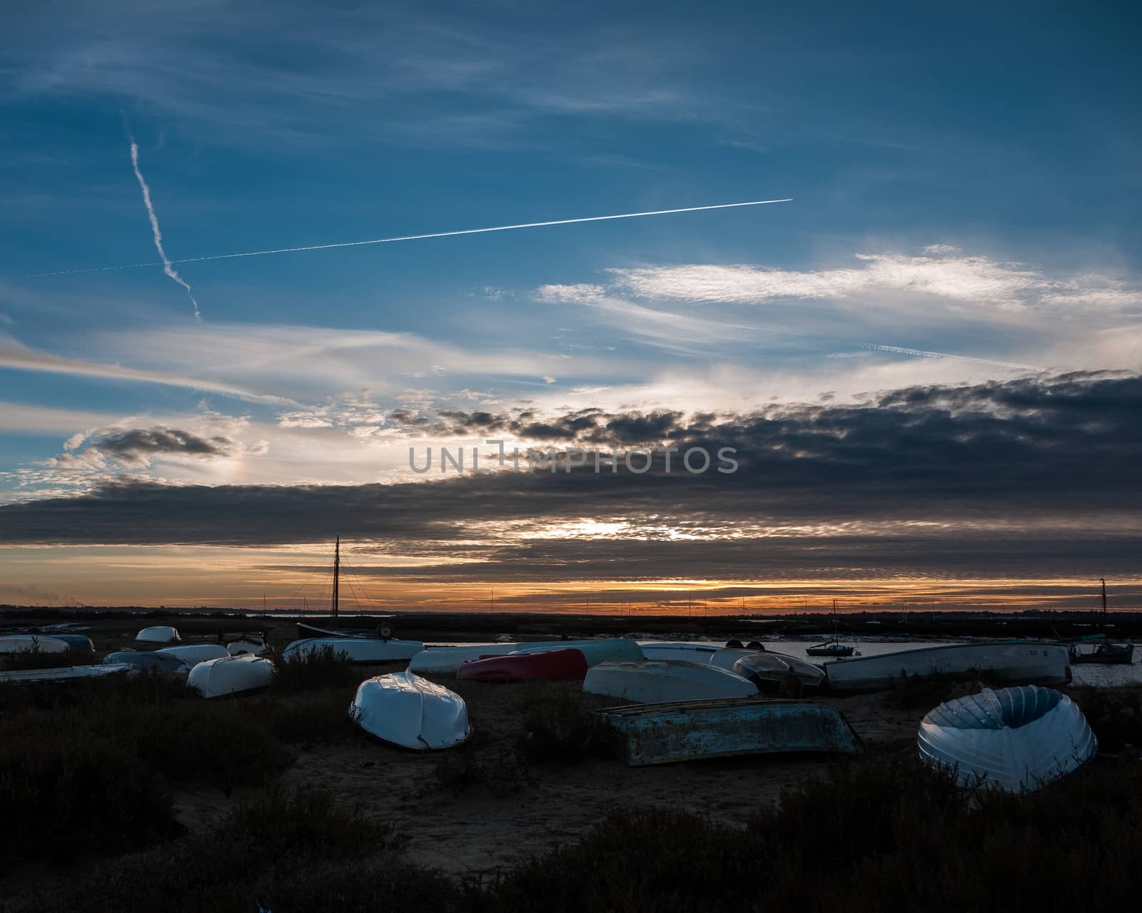 coastal boats beach sun set scene special nature background sky; essex; england; uk
