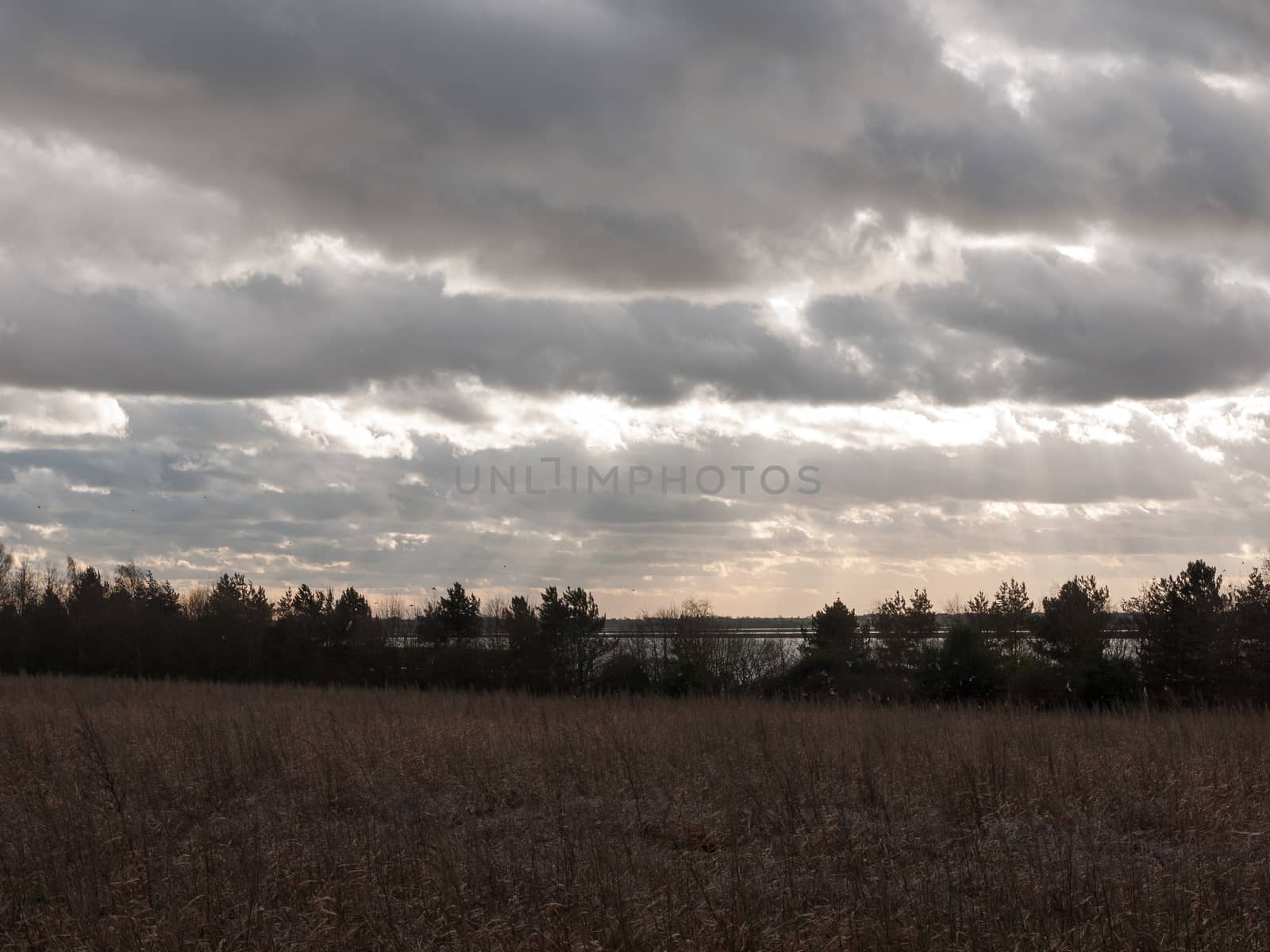 moody skyline clouds over autumn farm field ; essex; england; uk