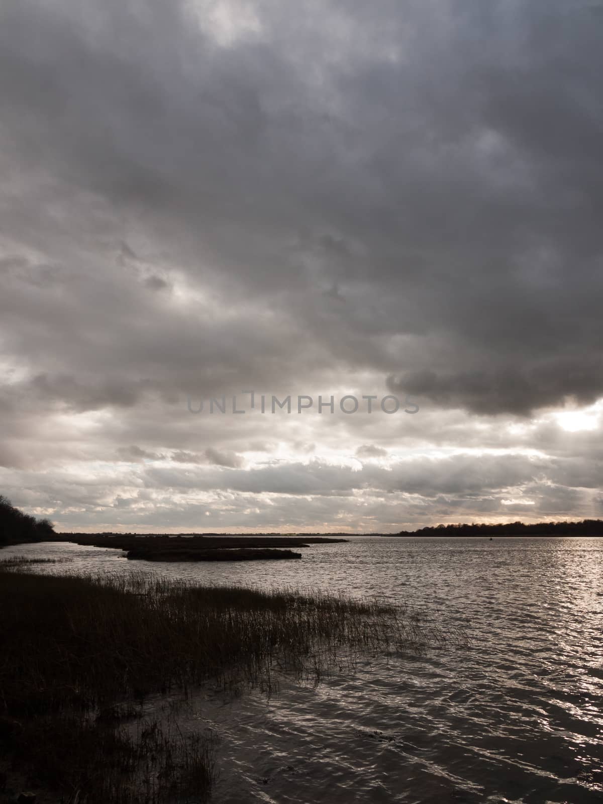 moody sky clouds autumn winter grey dark bay ocean river estuary; essex; england; uk