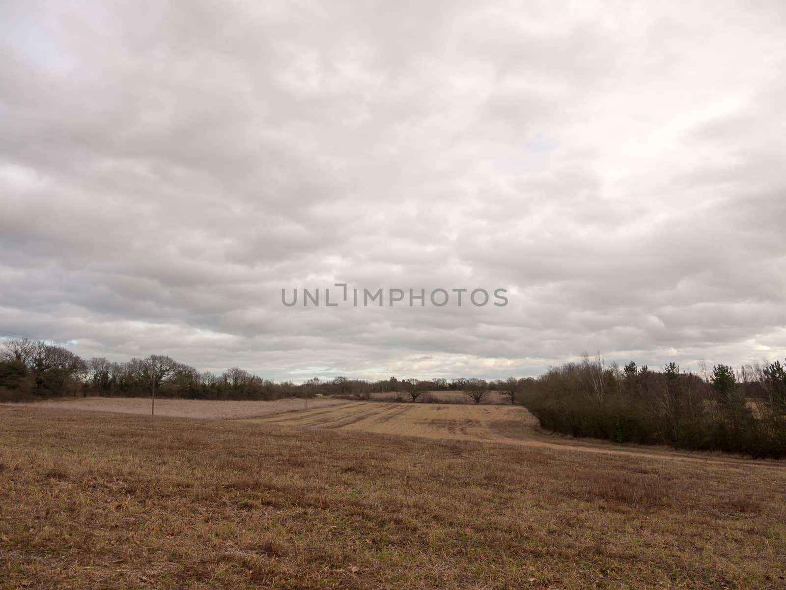 moody skyline clouds over autumn farm field ; essex; england; uk