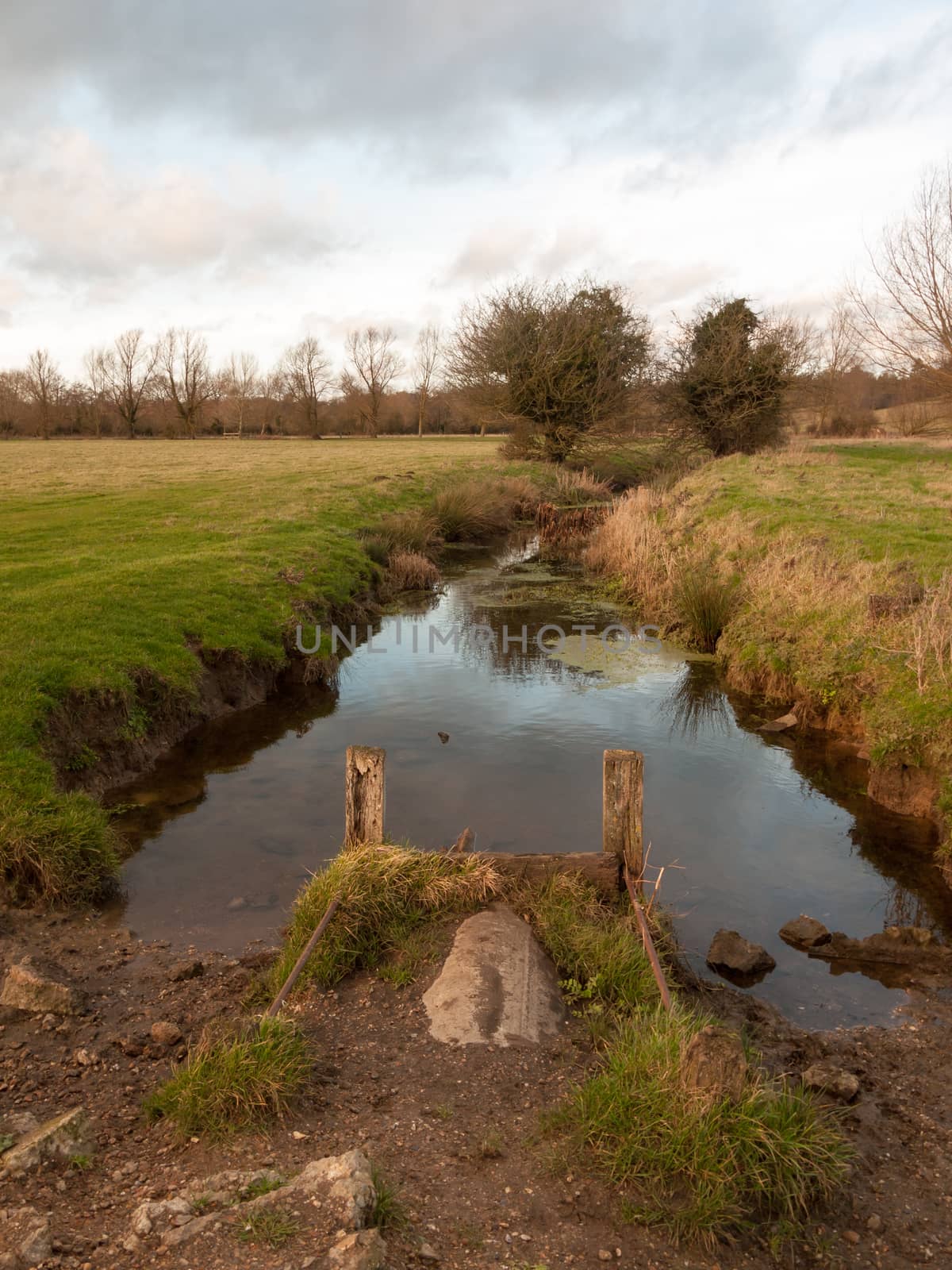 wet waterlogged country farm land stream eddy ; essex; england; uk