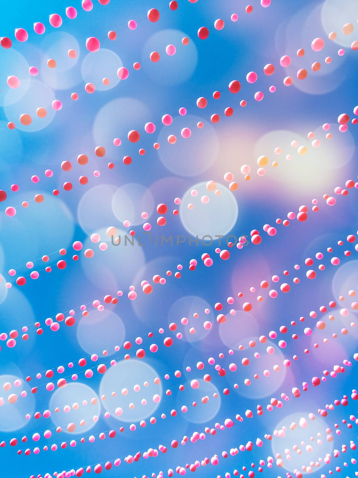 Party sky background with balloon decorations and bokeh lights. Ste-Catherine street, gay village neighborhood in Montreal (Quebec, Canada).