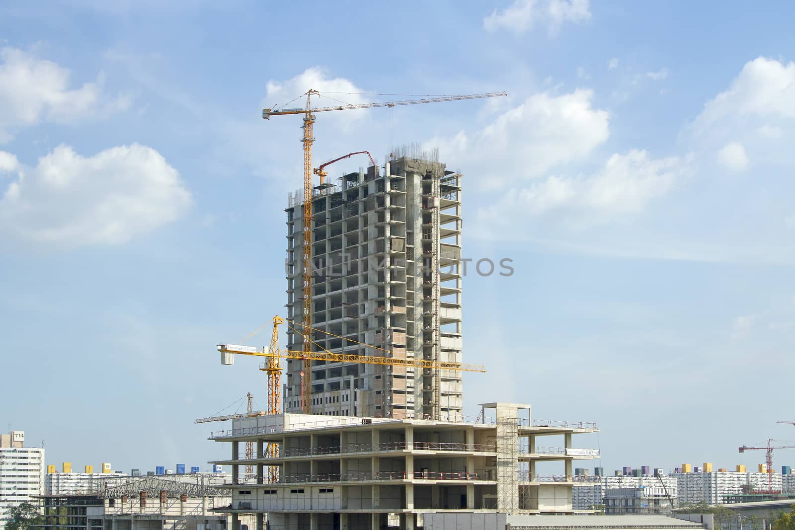 building site with cranes and blue sky