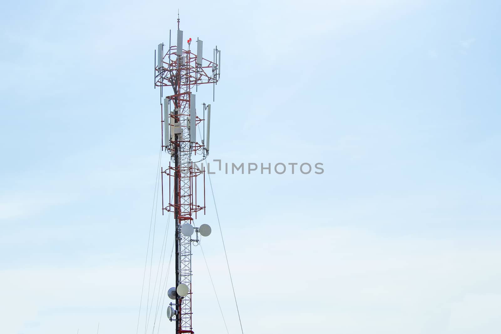 Mobile phone communication tower transmission  signal with blue sky background and leash