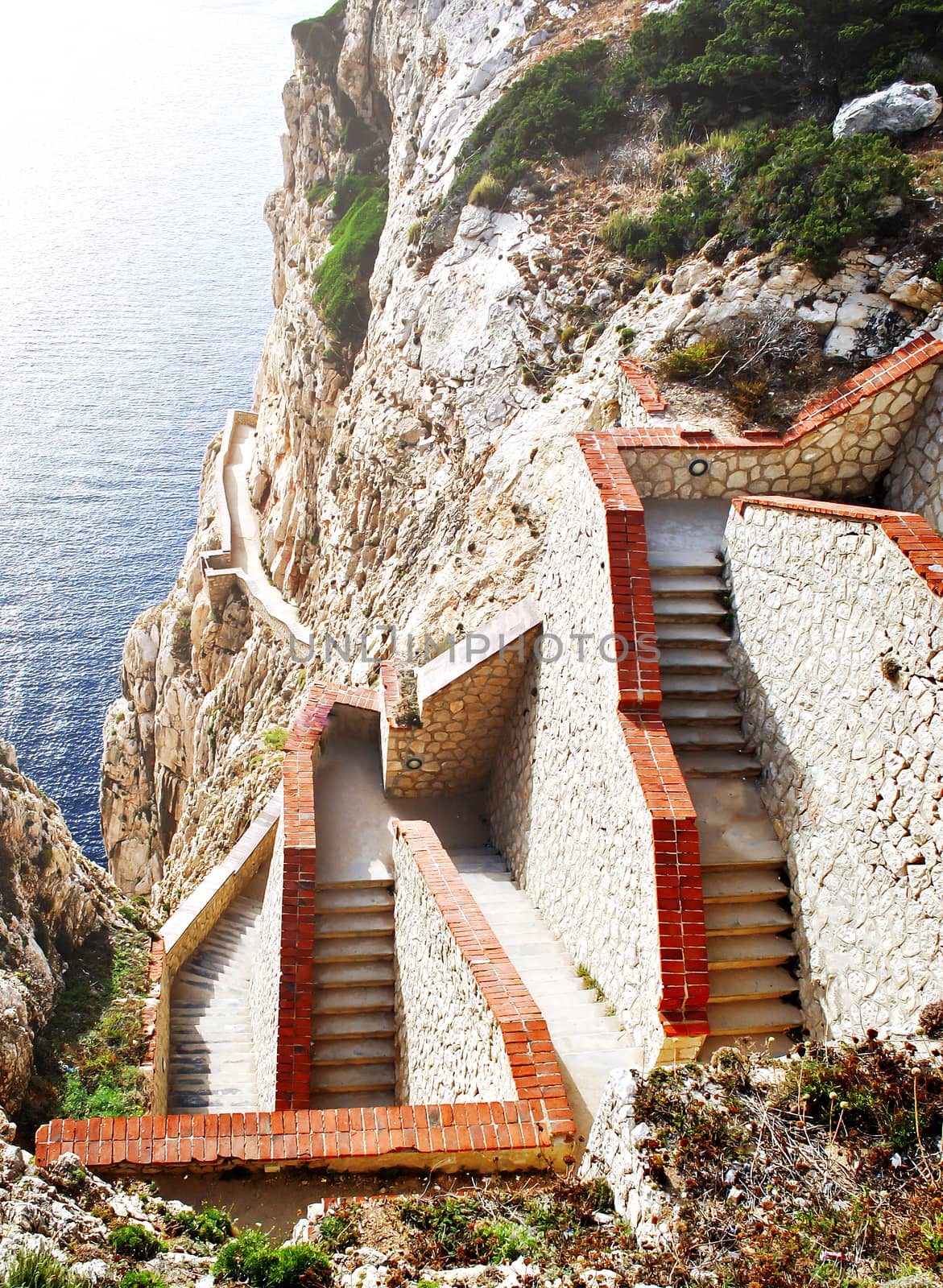 steep staircase built on a mountain overlooking the sea in Sardinia, Italy