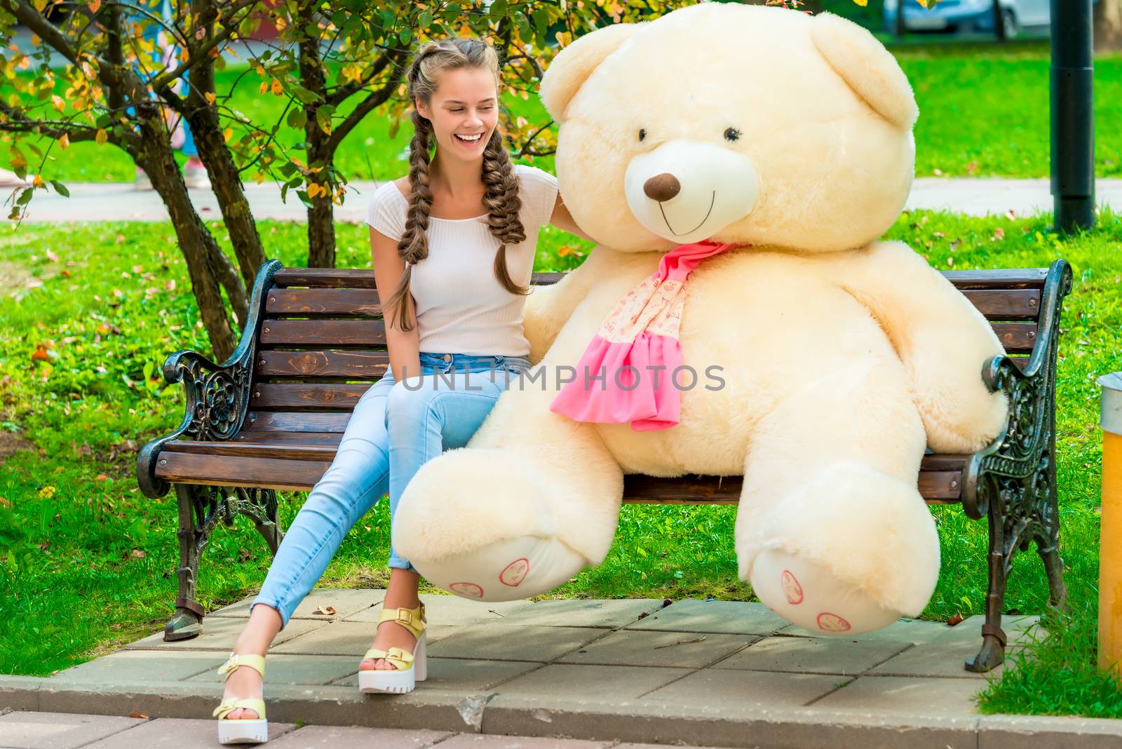 happy girl on a bench with your favorite teddy bear in the park by kosmsos111