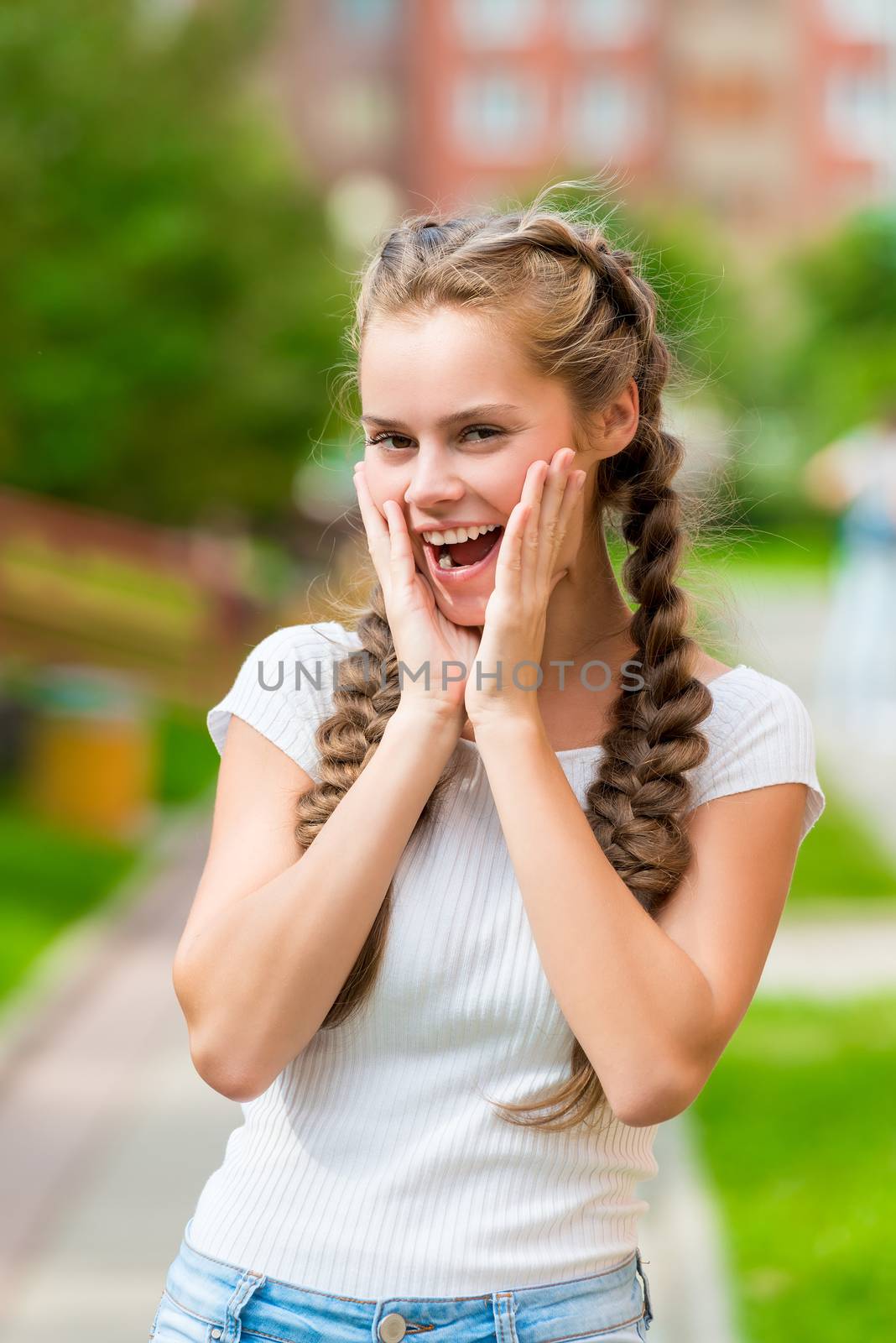 emotional joyful girl with two braids posing in summer park by kosmsos111