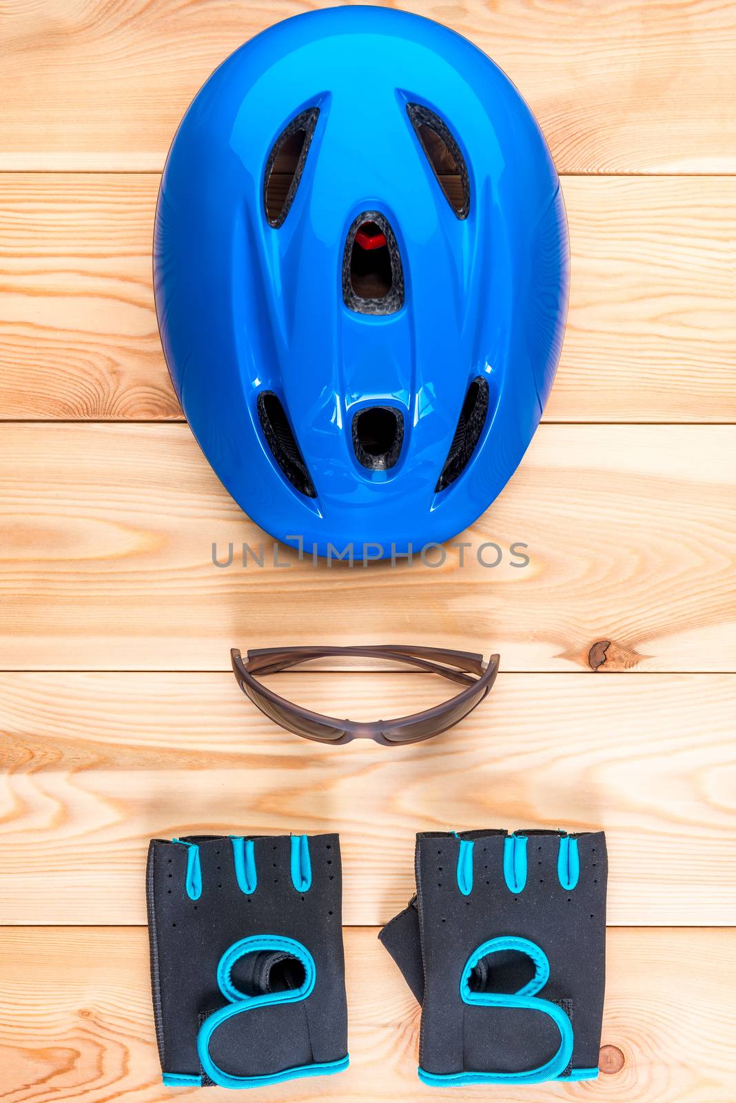 bicycle helmet and pair of gloves top view vertical shot