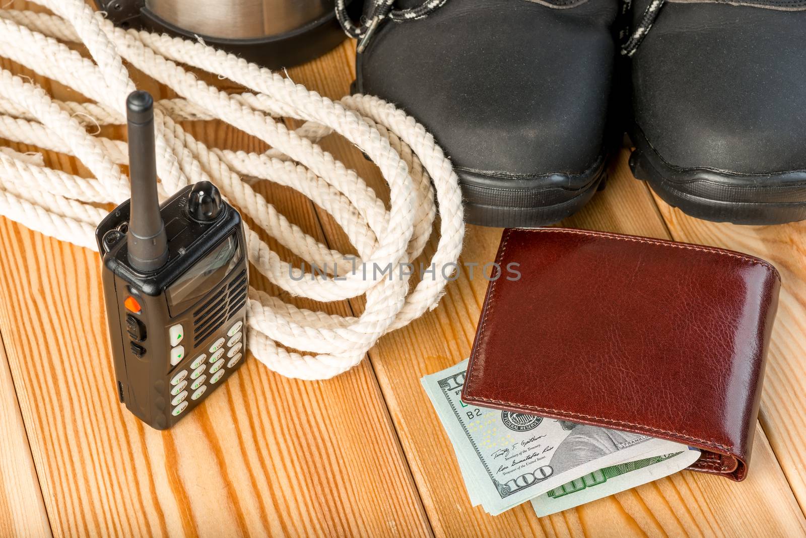 walkie-talkie, rope, shoes and some money for a dangerous winter hike - close-up objects