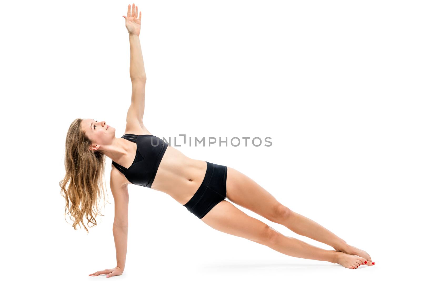 beautiful young slender woman doing sports on a white background