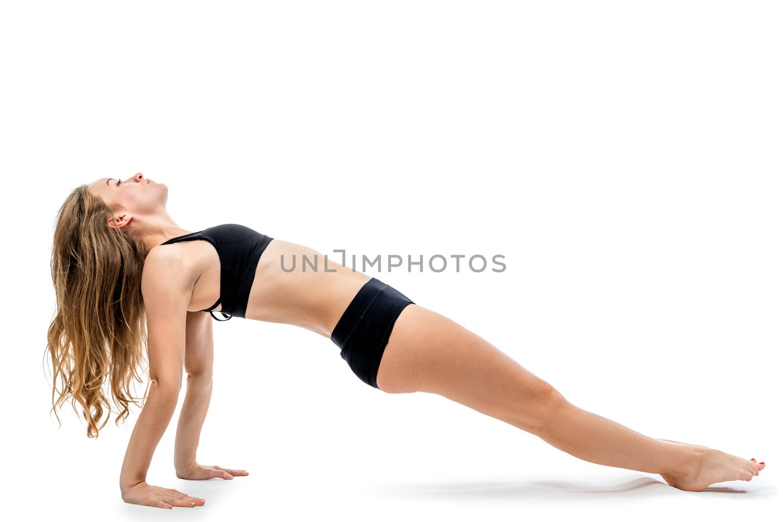 shapely beautiful woman during a workout on a white background