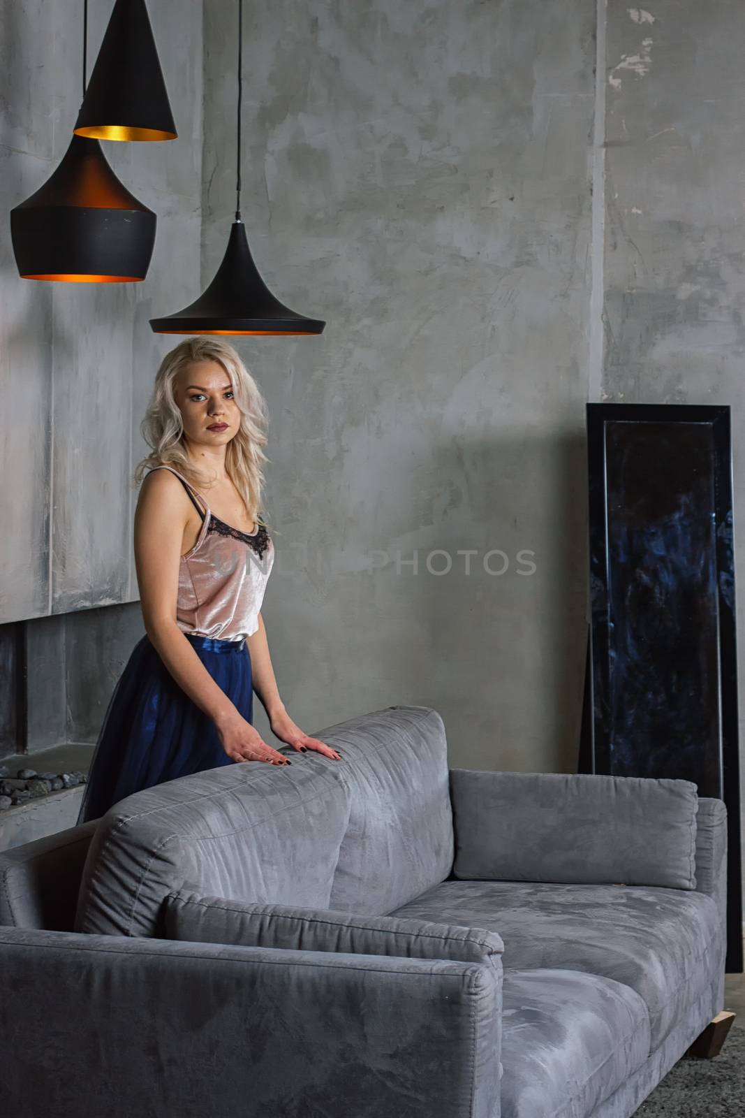 Young stunning sexy woman posing in loft lounge interior by victosha