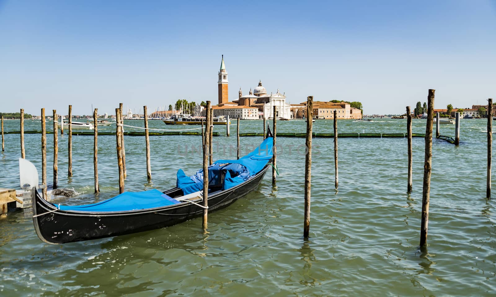 beautiful view of the canal with a floating gondola in Venice, Italy