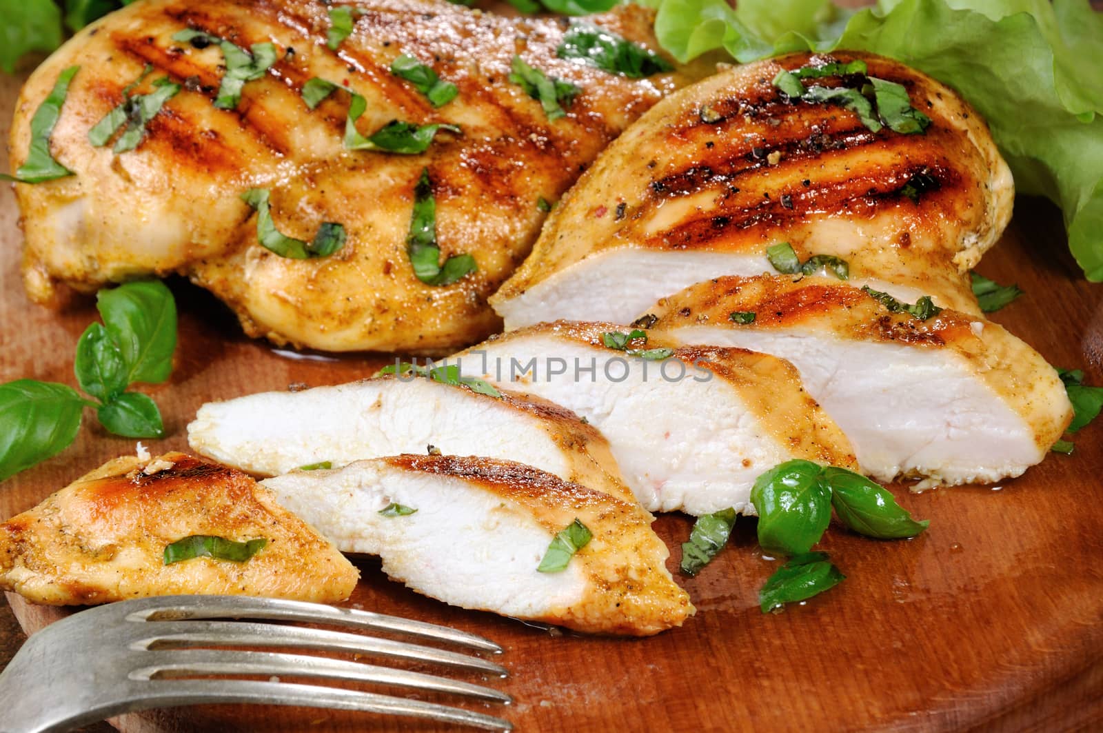 Sliced juicy, tender chicken breast grill close-up.