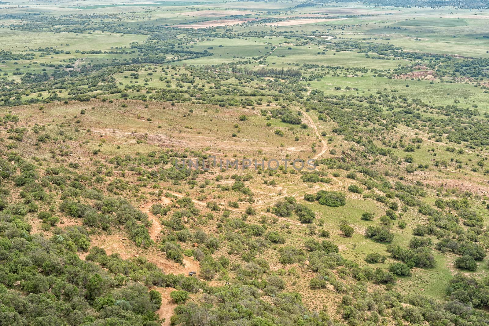 The view towards the North-West from the Koranna Mountain near Excelsior. A 4x4 road and two motorcycles are visible