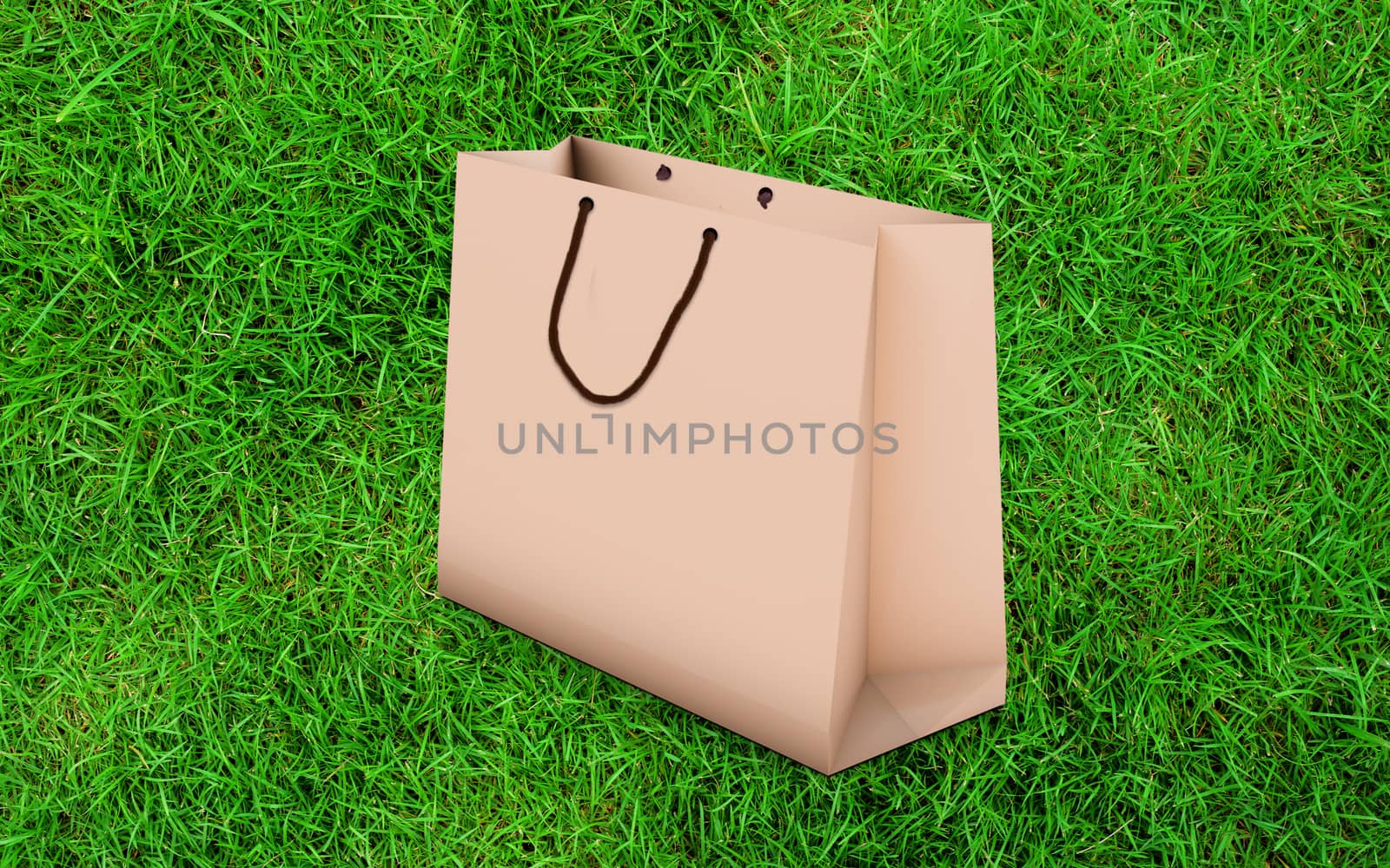 paper bag for shopping on a grass background by boys1983@mail.ru