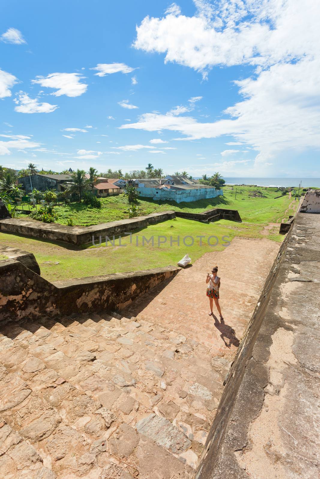 Sri Lanka, Asia, Galle - A woman visiting the medieval town wall of Galle