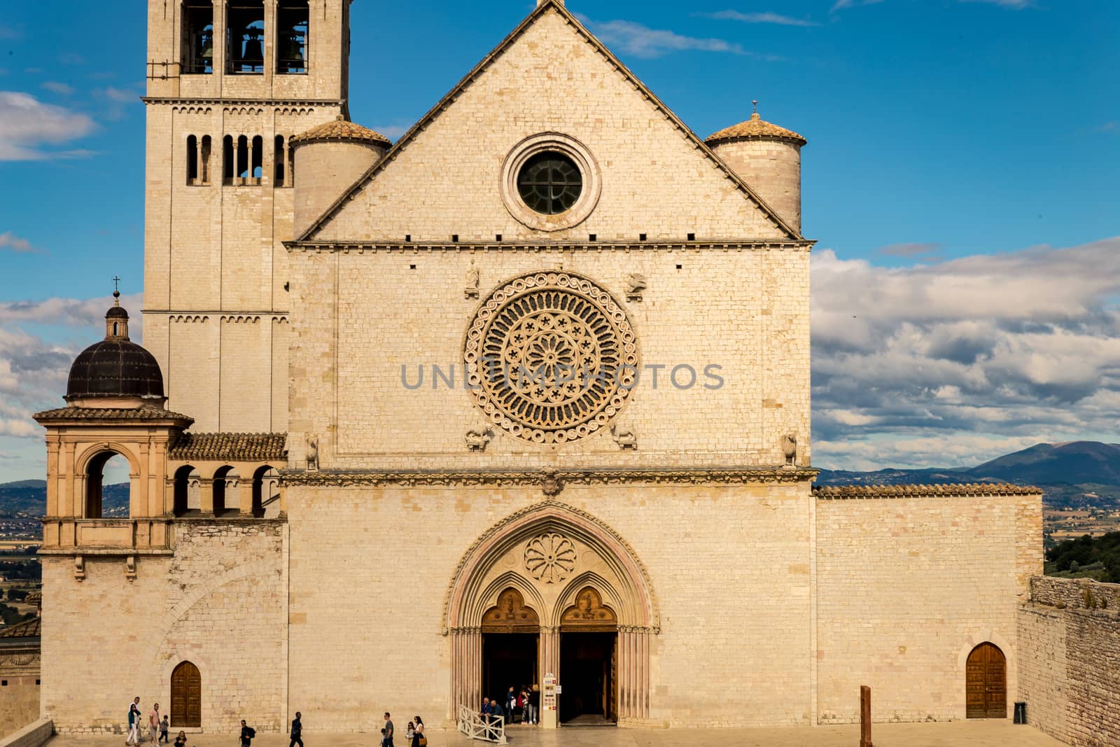 St. Francis of Assisi Church with the statue of St. Francis on a horse in the foreground. St. Francis is the patron saint of Italy. The bell tower can be seen from miles away.