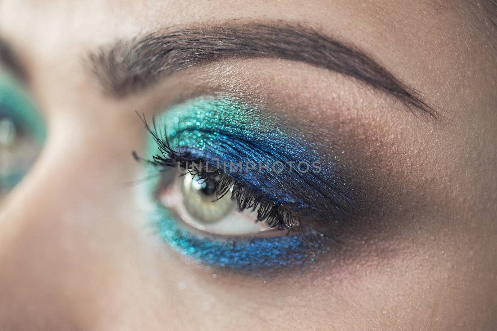 Turquoise glamour make-up of woman eye - macro shot