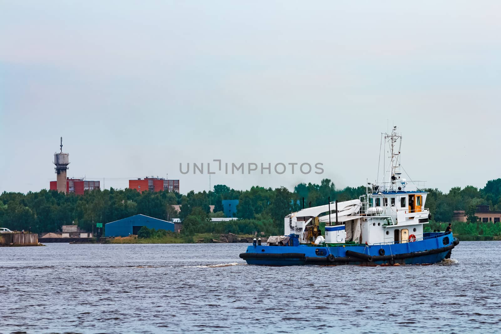 Blue tug ship underway by sengnsp