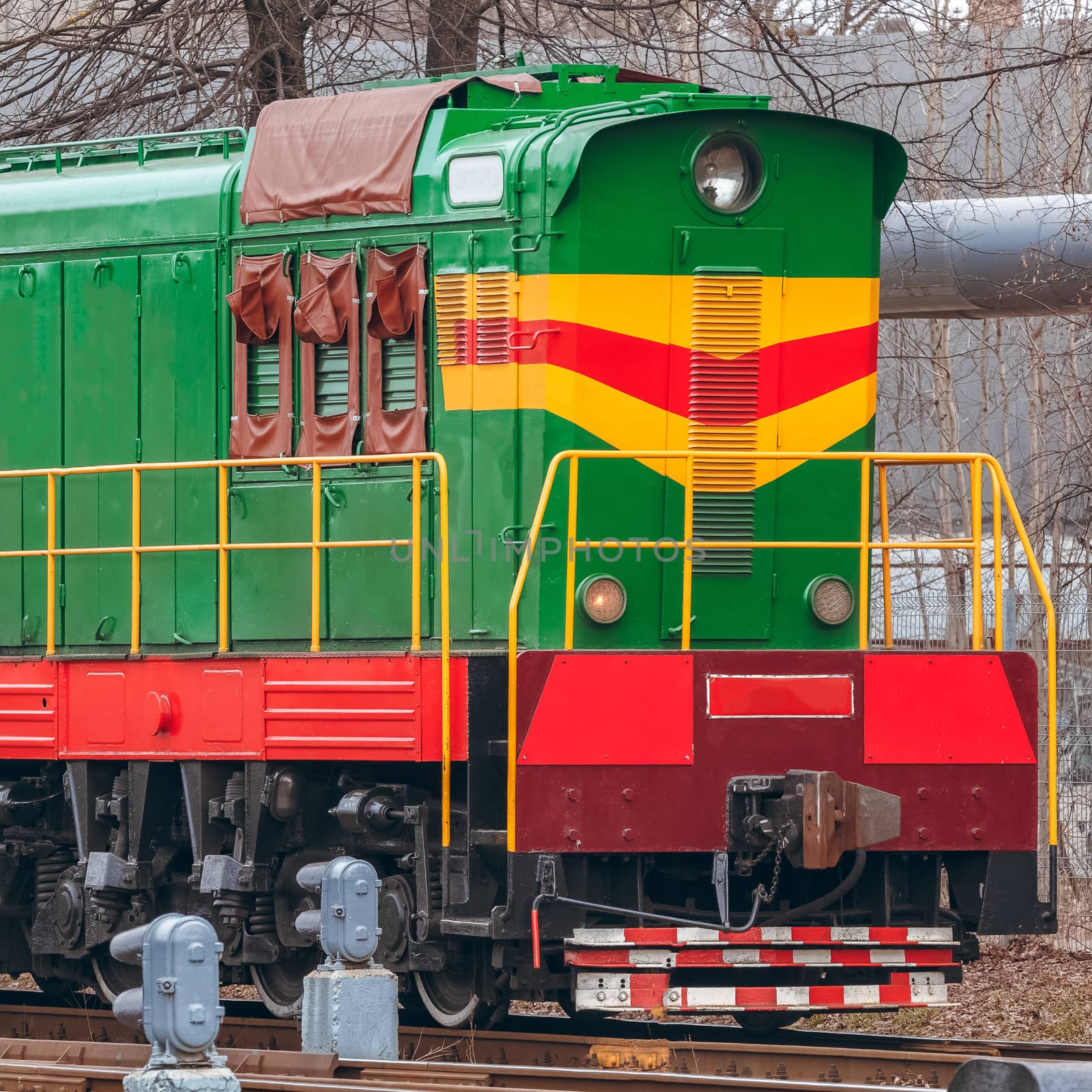 Green diesel cargo locomotive. Freight train in action