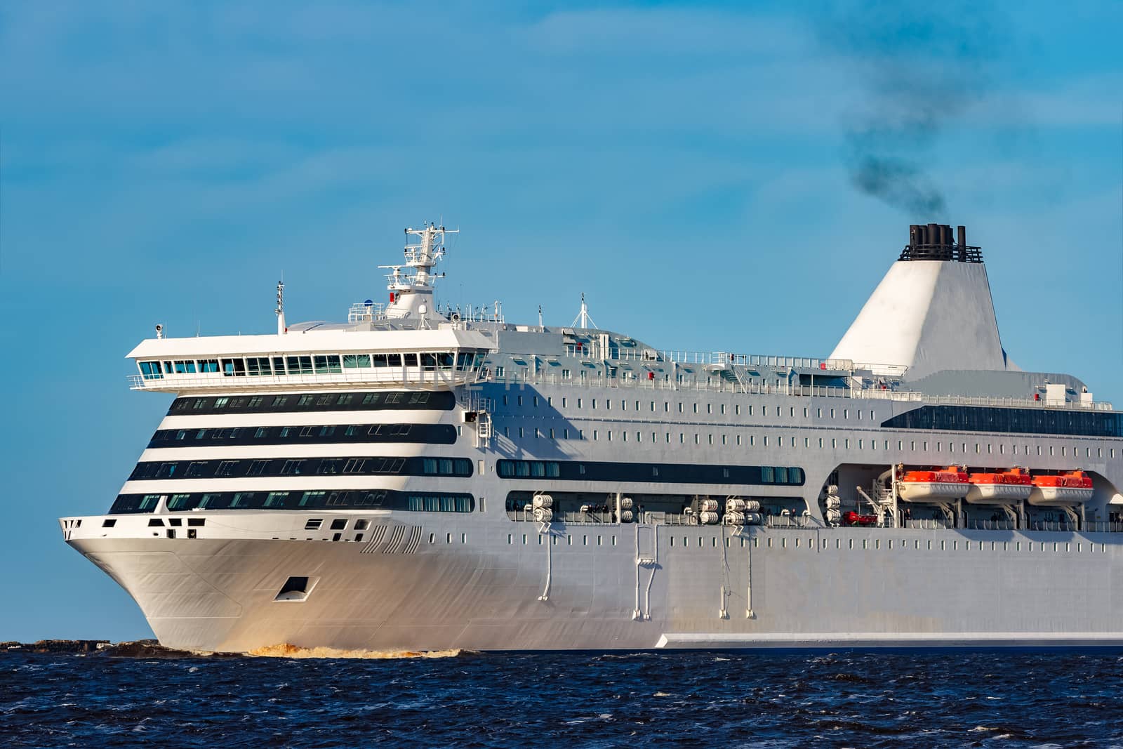 White cruise liner sailing on a clear day