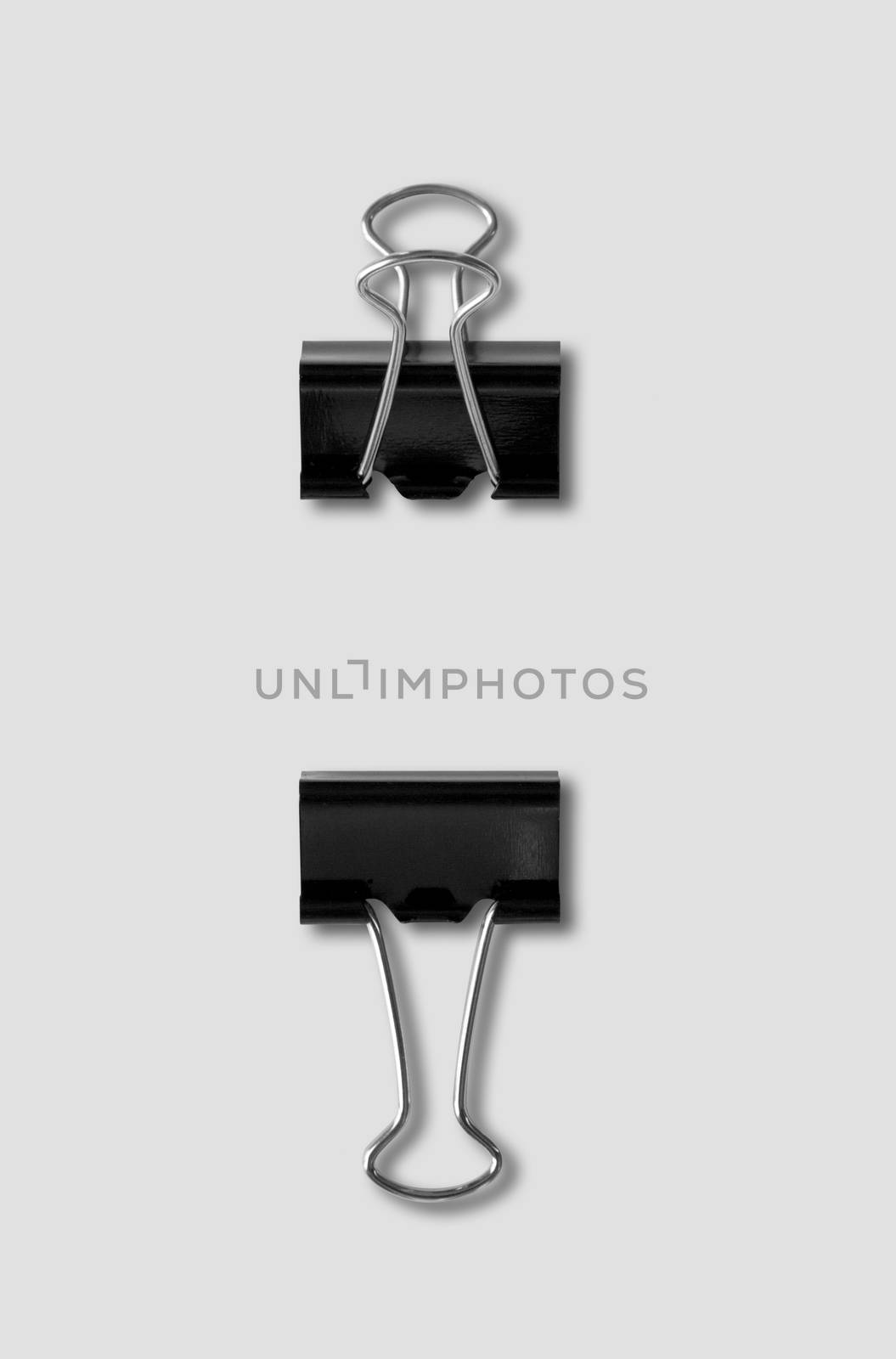 Generic bulldog clips isolated on grey background