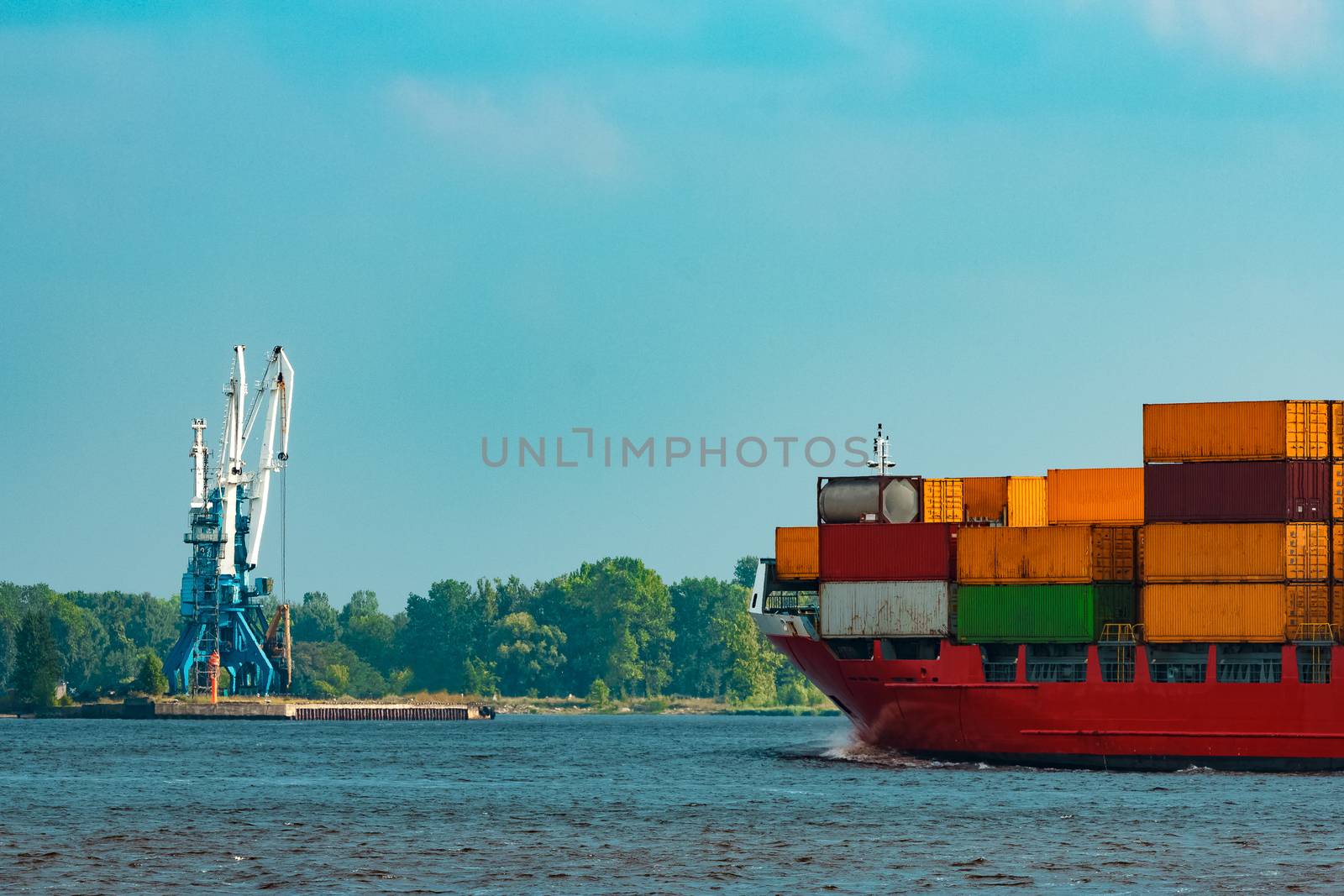 Red container ship underway by sengnsp