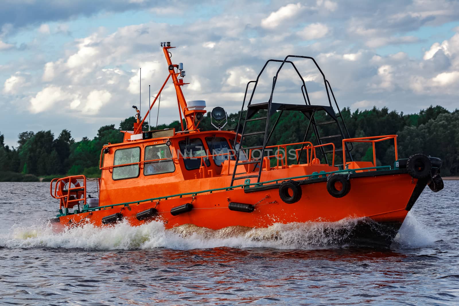 Orange pilot boat in action by sengnsp