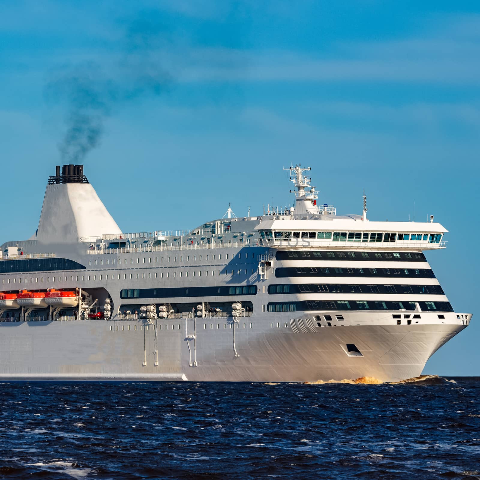 White cruise liner sailing on a clear day