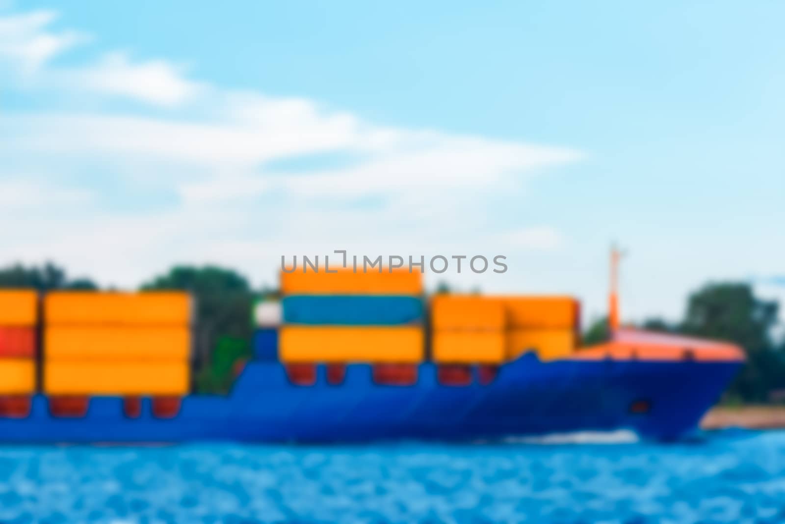 Blue cargo ship - soft lens bokeh image. Defocused background