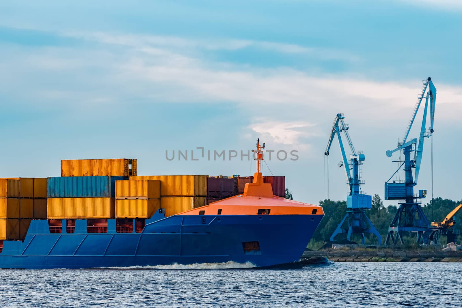 Blue container ship. Global logistics and merchandise transfer