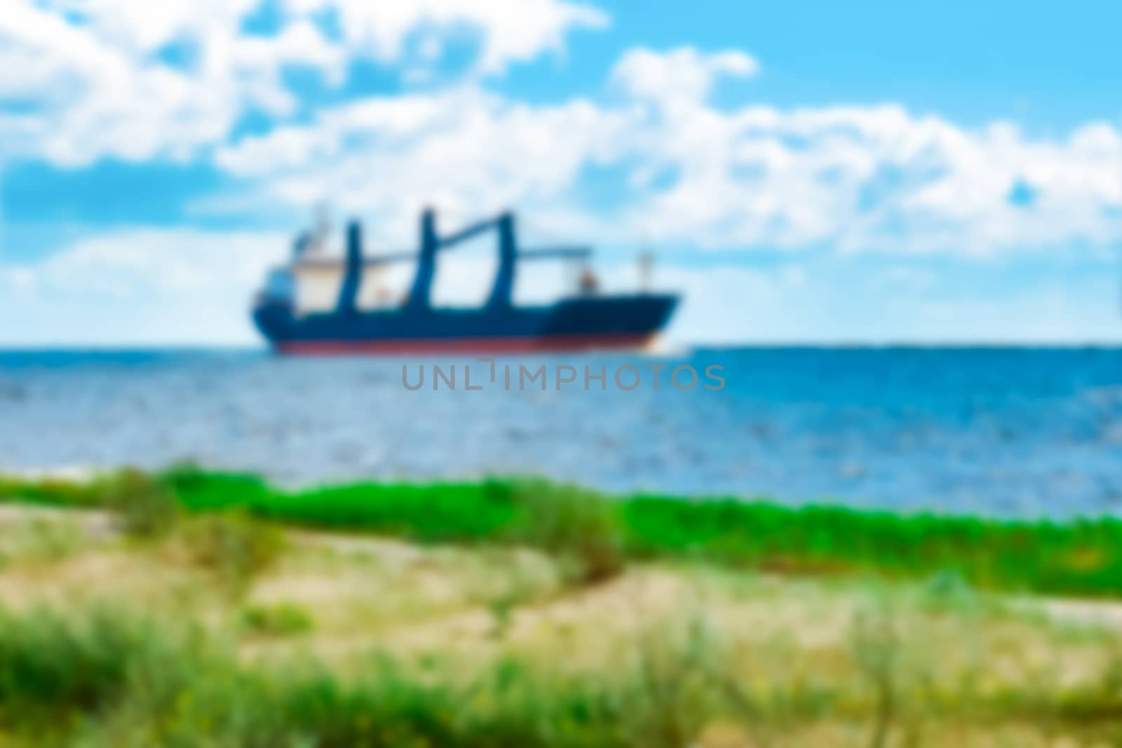 Blue cargo ship - blurred image by sengnsp