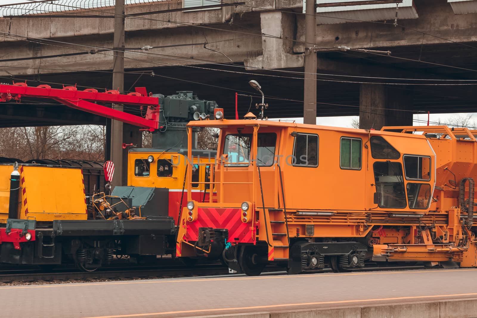 Ballast distributing and profiling track machine. Repair train