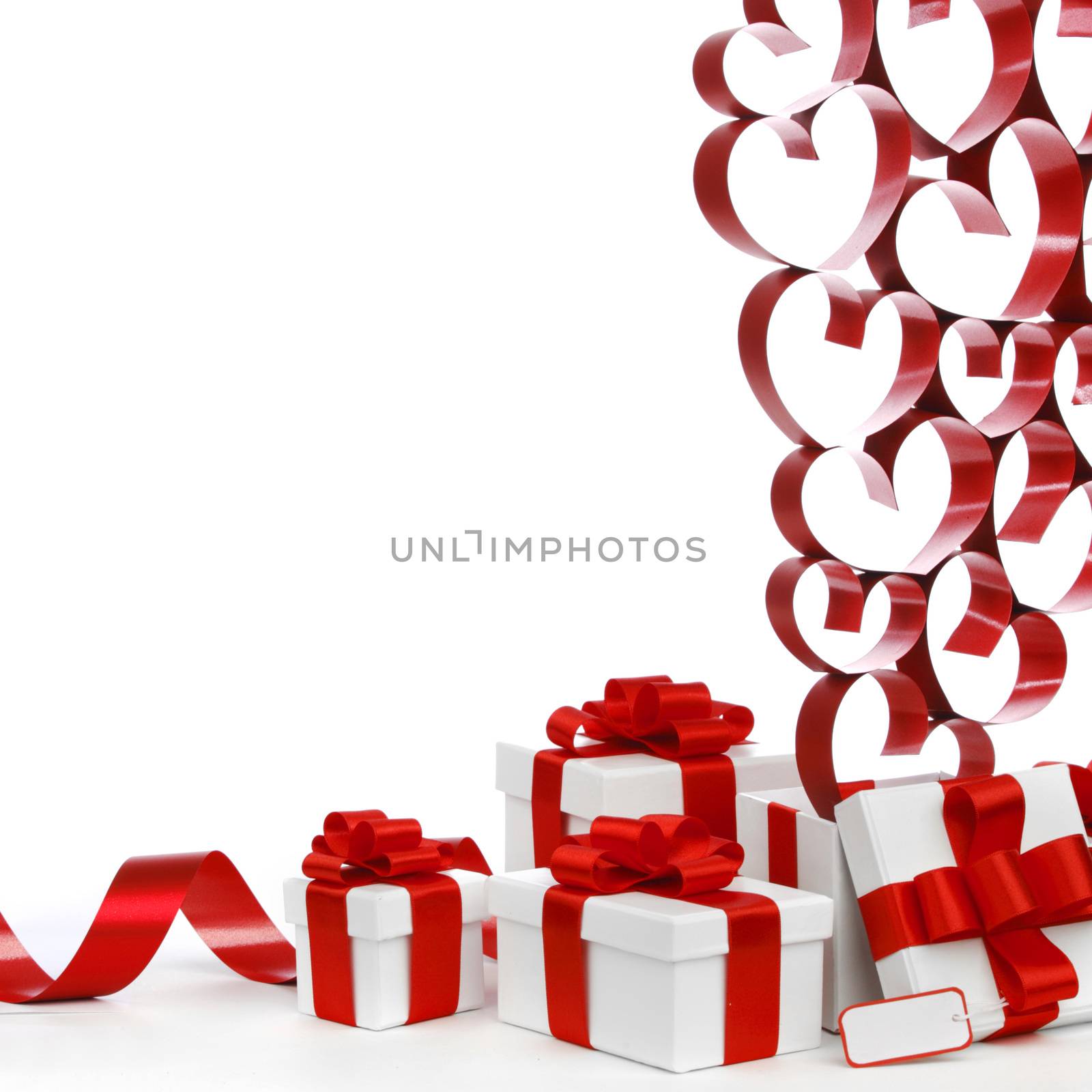 White boxes with red ribbons and decorative hearts isolated on white background