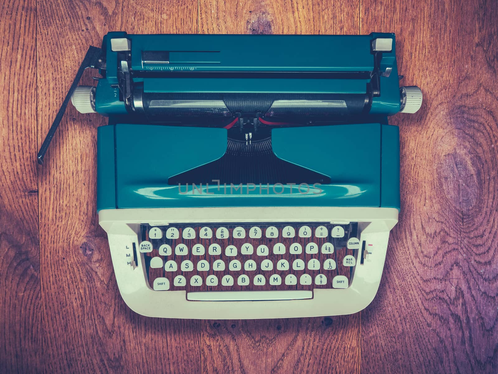 A Retro Vintage Typewriter On A Rustic Wooden Table