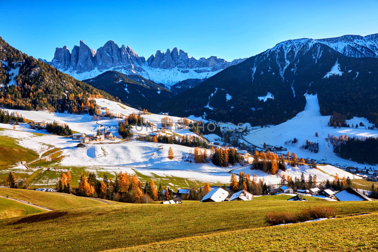Panoramic view of winter sunny day in St. Magdalena village, Funes valley, Odle Group, Dolomiti Alps. Bolzano - South Tyrol, Italy