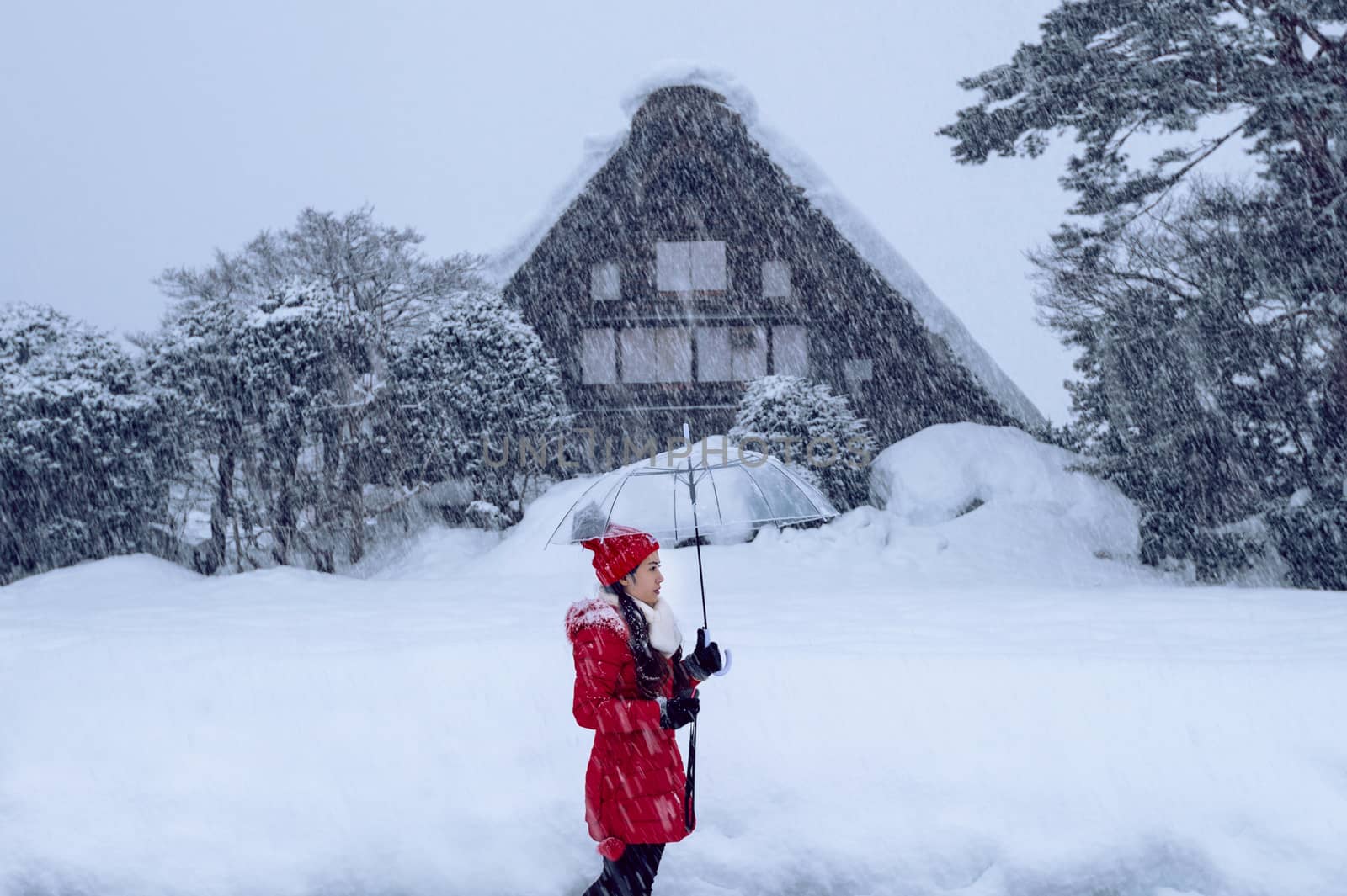 Young woman in Shirakawa-go village in winter, UNESCO world heritage sites, Japan.