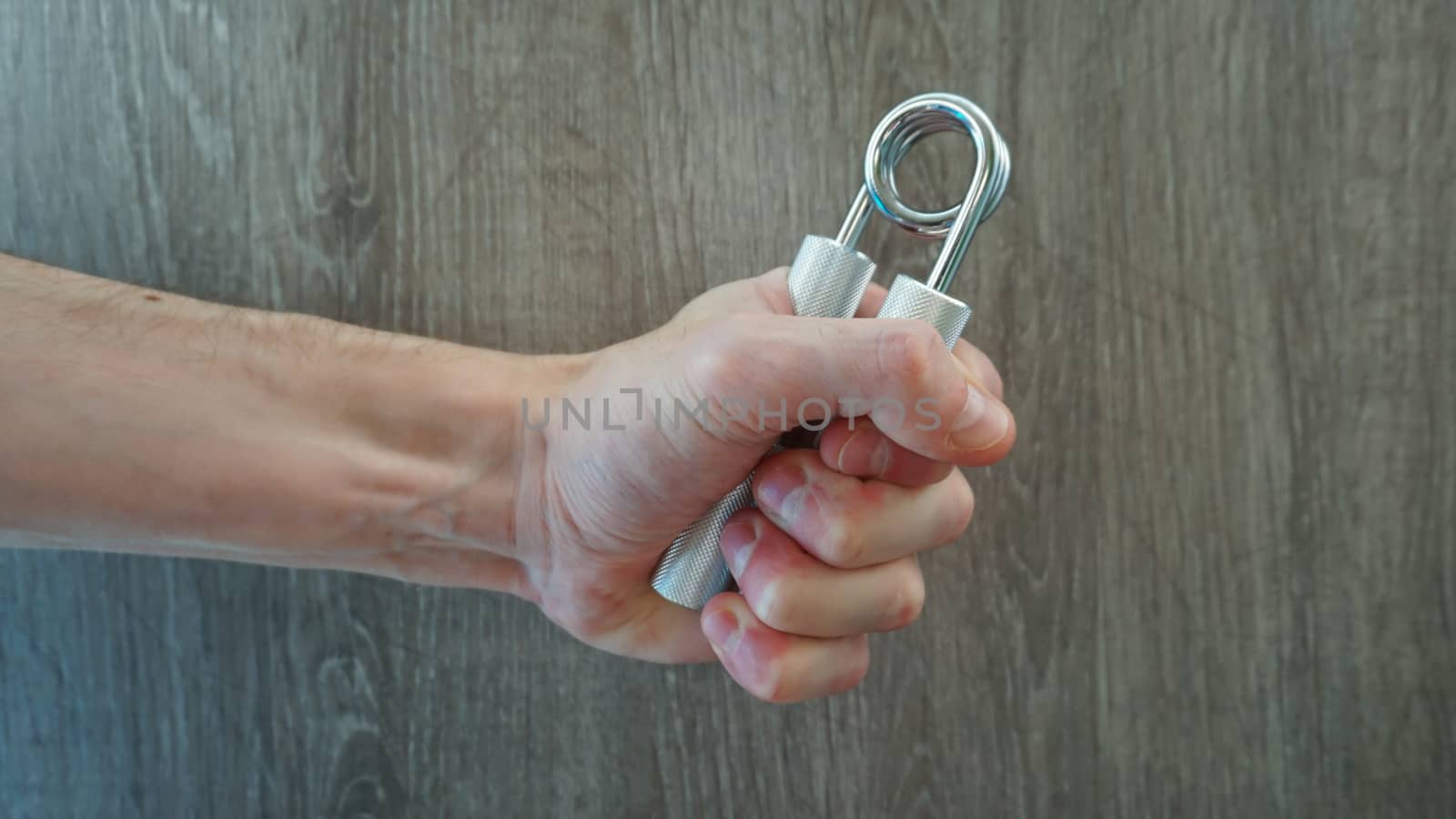 hand expander in the hand of a young athlete by nolimit046