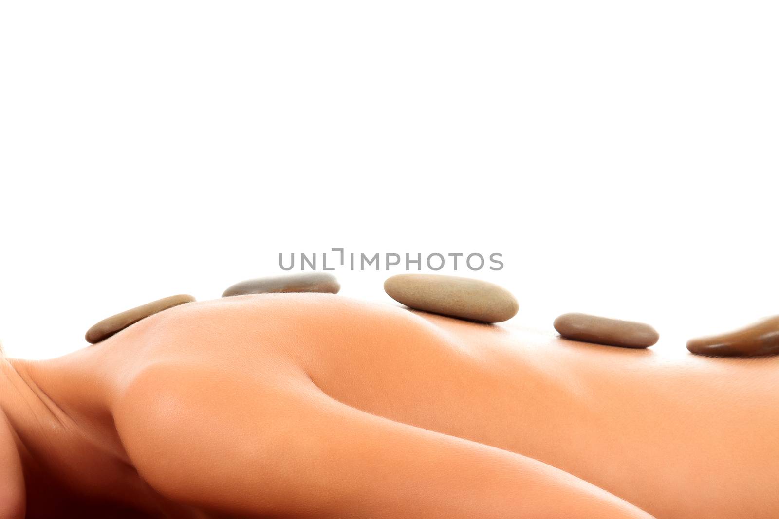 Closeup shot of a young woman getting spa treatment, isolated on white background