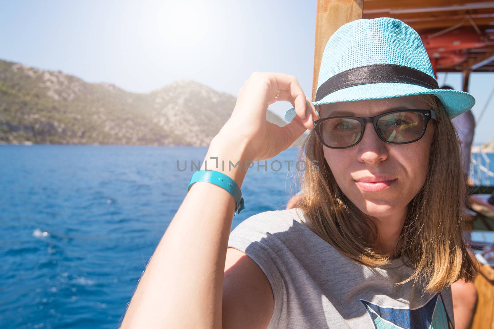 Beautiful woman enjoying her vacation on a cruise of Mediterranean Sea