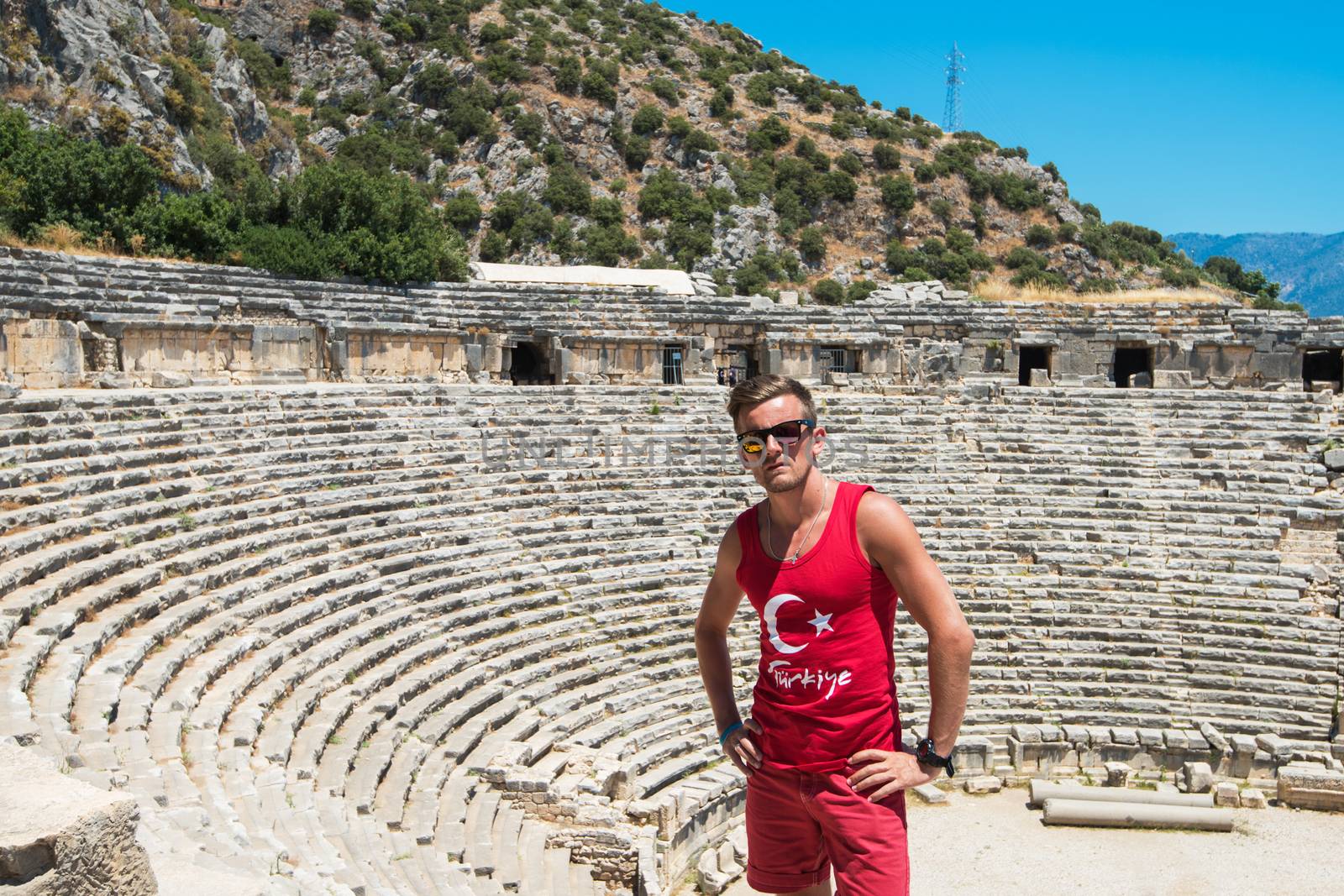 Young man at theatre in Myra ancient city of Antalya in Turkey.