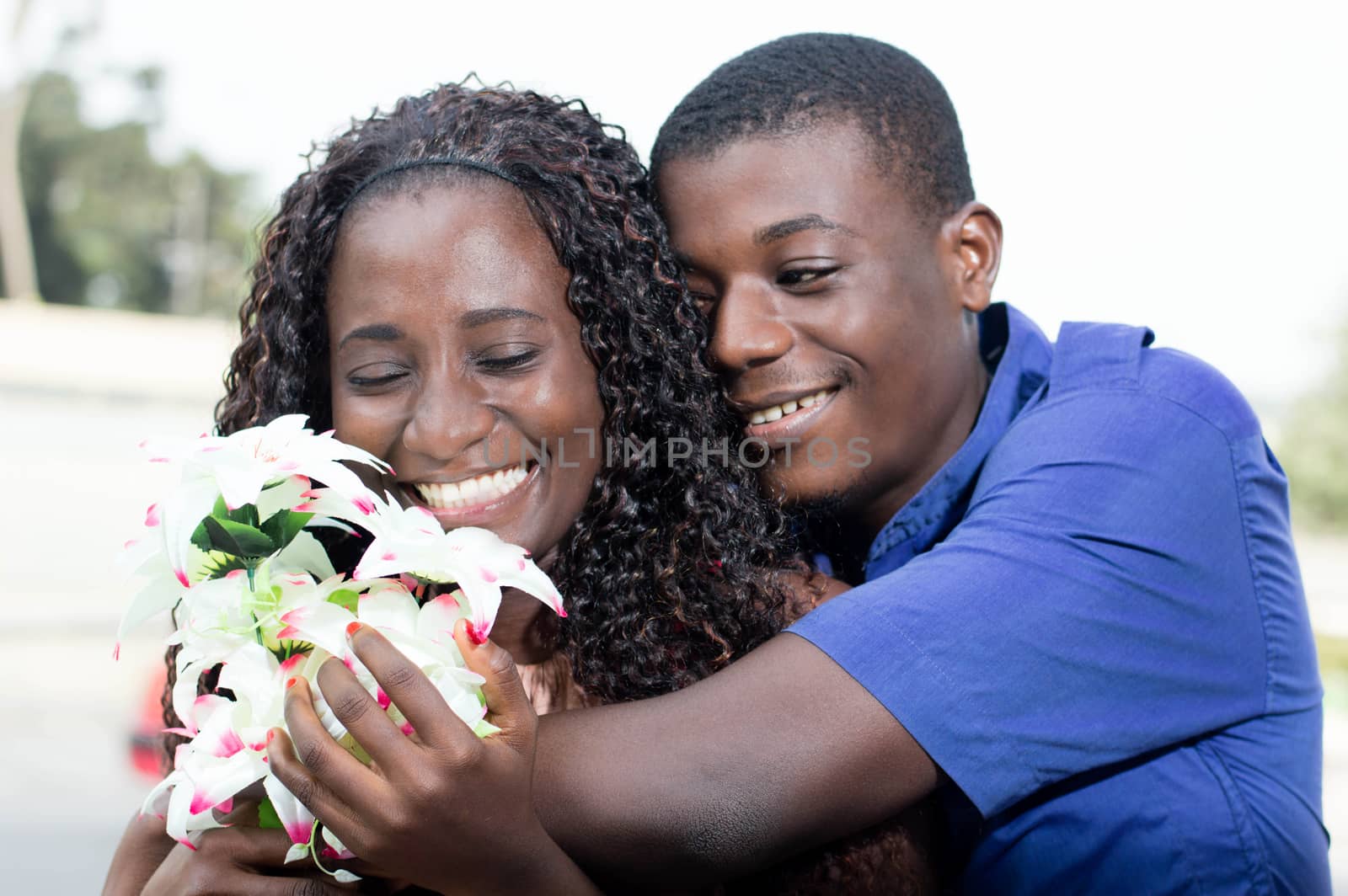 young woman is  very  happy to receive this beautiful flower.